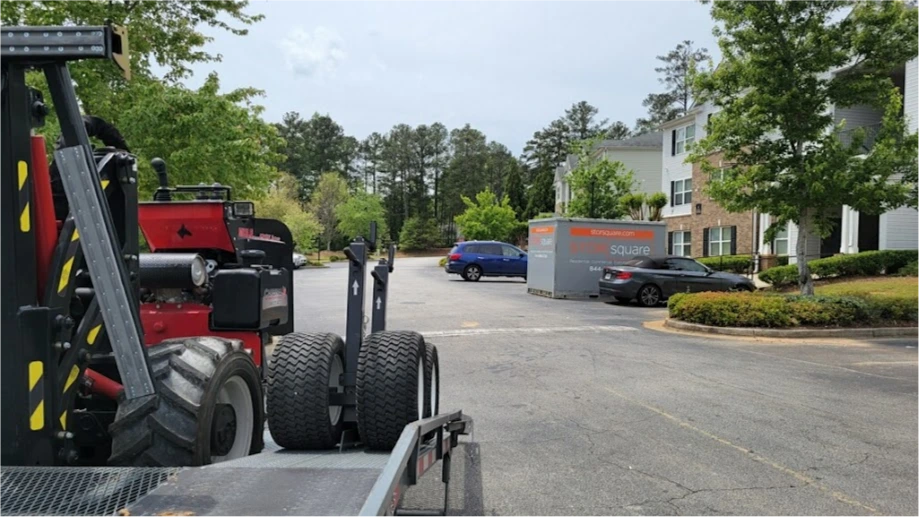 STORsquare portable storage container being delivered with specialized equipment for apartment and residential storage in Loudon, TN.