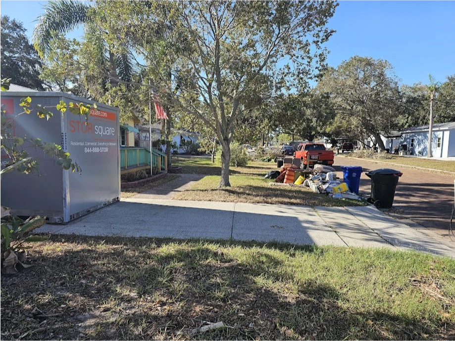 STORsquare storage container placed on a Galveston County driveway near a residential cleanout area.