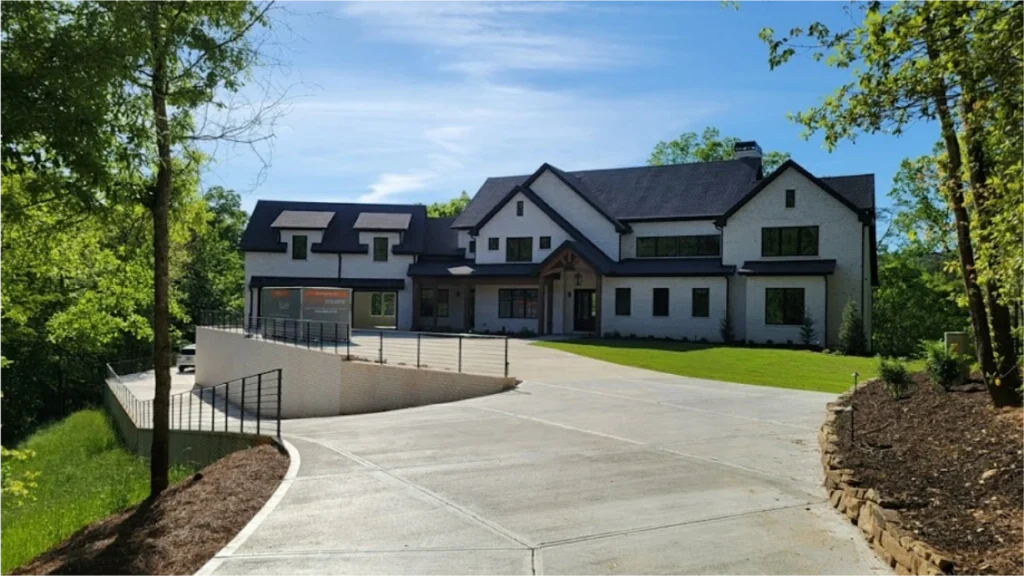 STORsquare storage container placed in a Pearland driveway beside a large modern home.