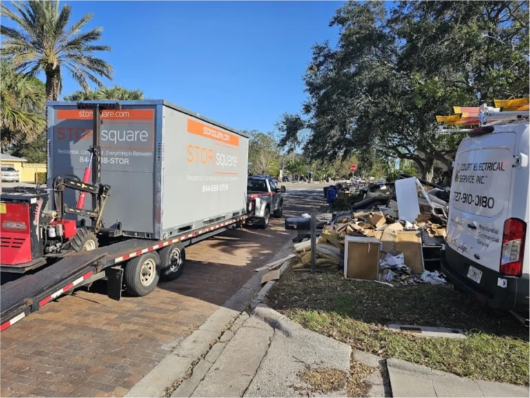 STORsquare container on a delivery trailer with Mule equipment near curbside debris in The Woodlands.