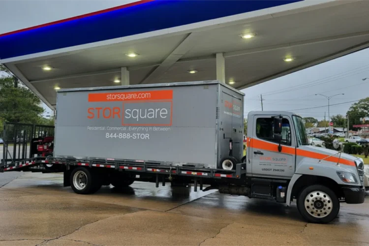 STORsquare truck delivering commercial storage containers to a business location.