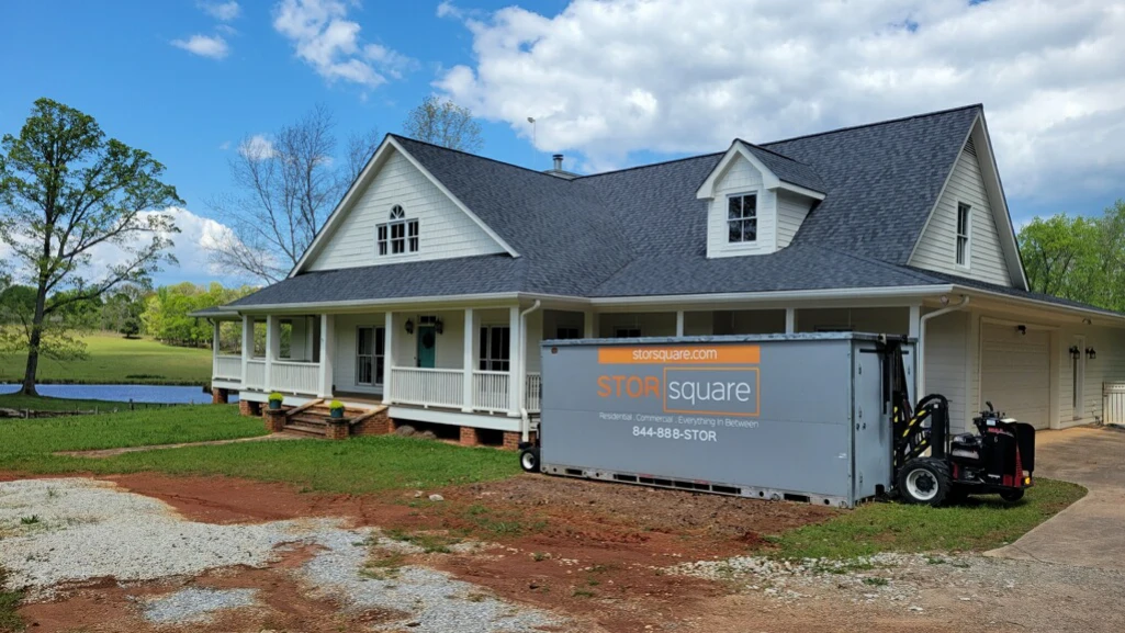 STORsquare portable storage container beside a Florida home during a household move