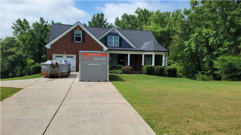STORsquare portable storage container placed on a residential driveway beside a brick home in Maitland, FL.