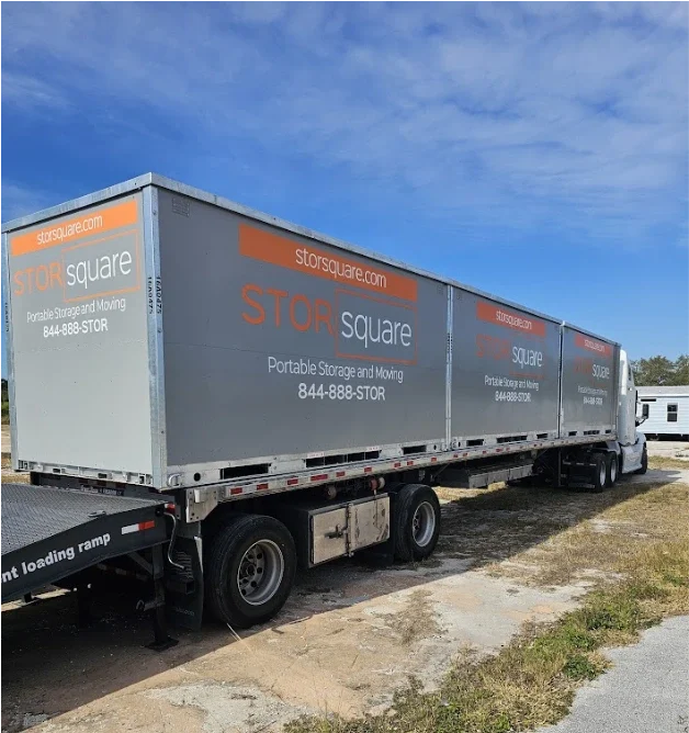 Multiple STORsquare storage containers loaded on a transport truck in Weddington.