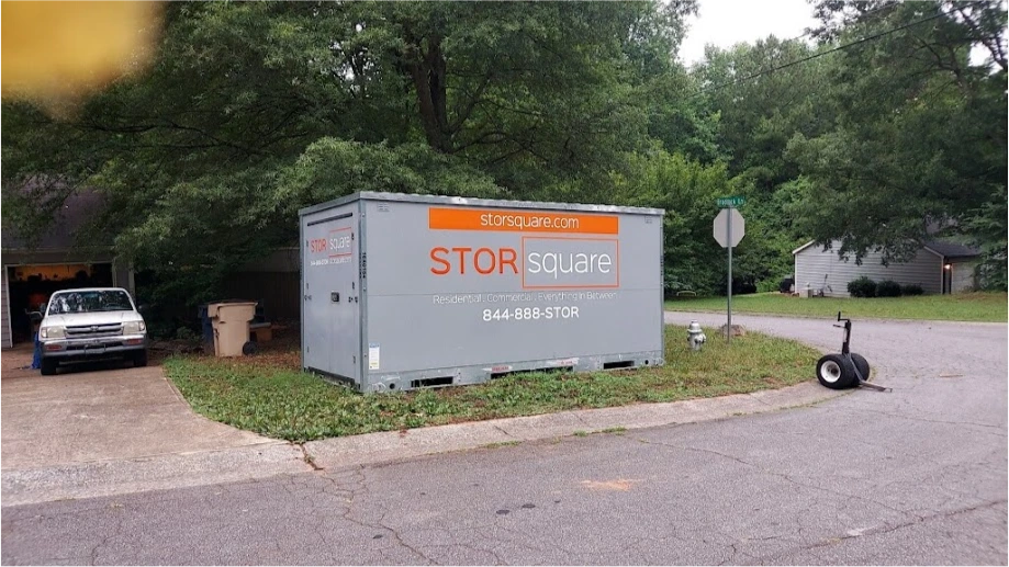 STORsquare portable storage container placed near a street corner at a ChampionsGate residential property.