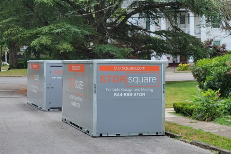 Two STORsquare portable storage containers placed along a residential street in Pine Hills, FL.