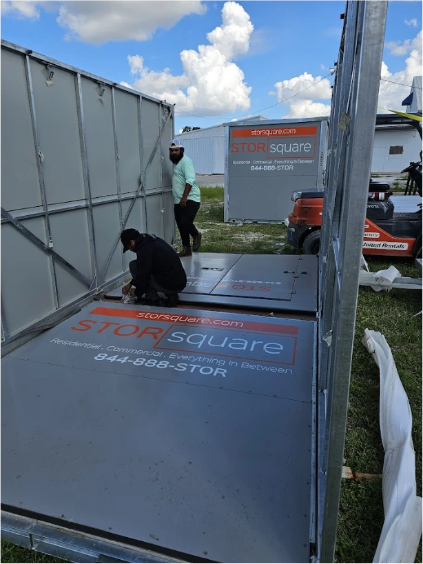 STORsquare portable storage unit being assembled with another container visible in Cornelia.