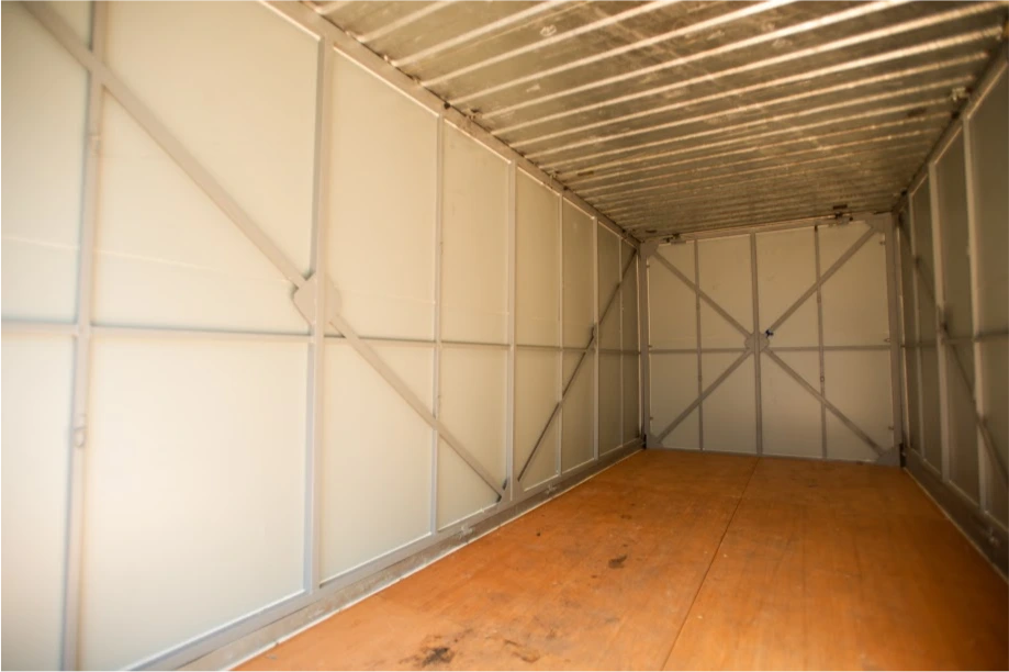 Clean interior of a STORsquare portable storage unit in Louisville with open floor space and metal walls.