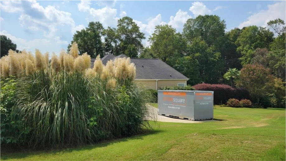 STORsquare portable storage unit placed in a grassy residential yard in Mocksville.