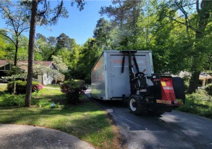 STORsquare portable storage unit being placed on a wooded residential driveway in Mocksville.