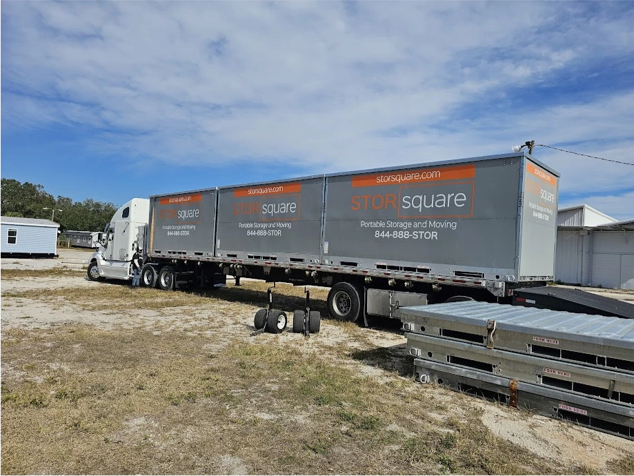 STORsquare portable storage units loaded on a transport trailer in Pineville.