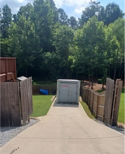 STORsquare portable storage unit placed at the bottom of a steep Powell, TN driveway.