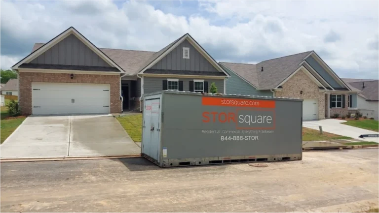 STORsquare portable storage container placed along a residential street beside newer homes in Commerce, GA.
