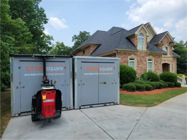 Two STORsquare storage containers positioned on a large residential driveway in Saint Cloud, FL.
