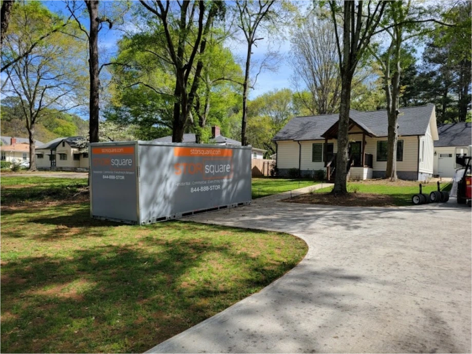 Two STORsquare portable storage containers placed beside a curved residential driveway in Commerce, GA.