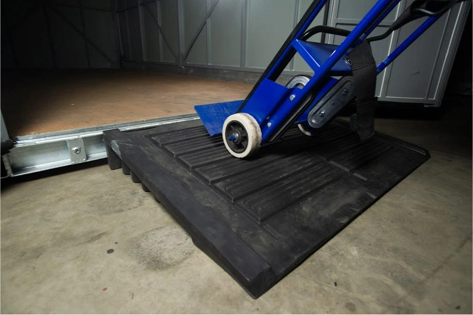 Hand truck positioned on a loading ramp leading into a STORsquare portable storage container for customers in Bloomingdale, FL.