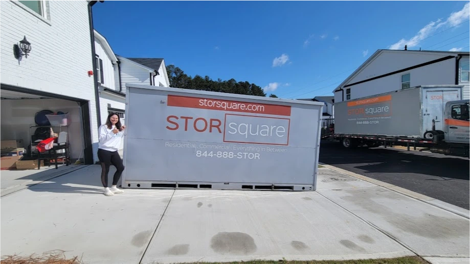 STORsquare mobile storage container positioned beside a home during a residential move for customers in Alcoa, TN.