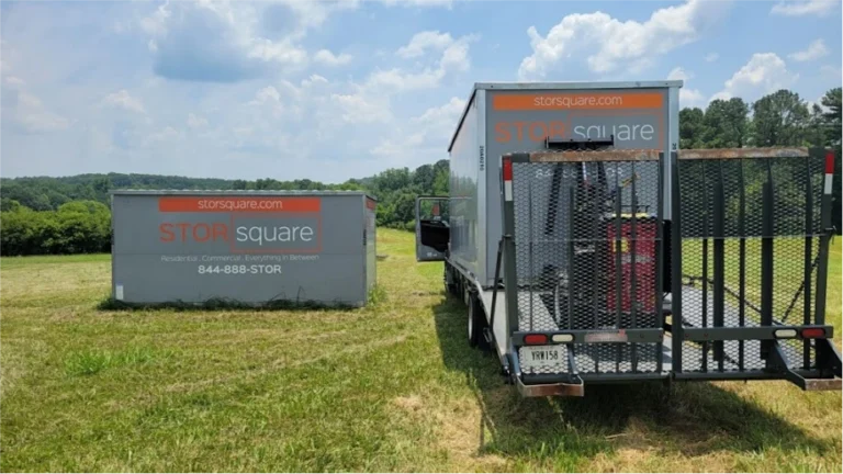 STORsquare portable storage container beside a delivery truck on an open property serving customers in Amherst, TN.