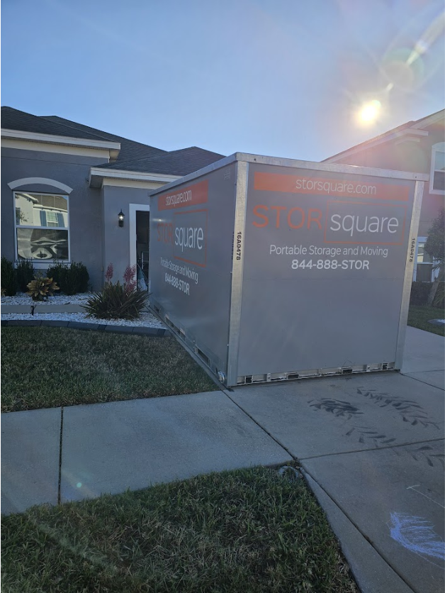 STORsquare portable storage container placed in a residential driveway beside a home for customers in Austell, GA.