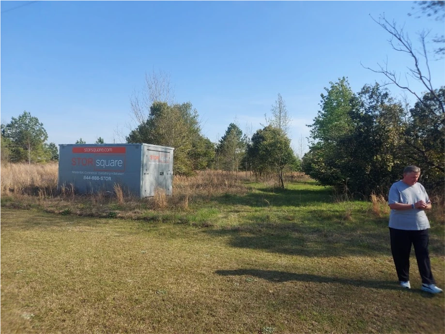 STORsquare portable storage container placed on a large grassy residential property for customers in Clinton, TN.