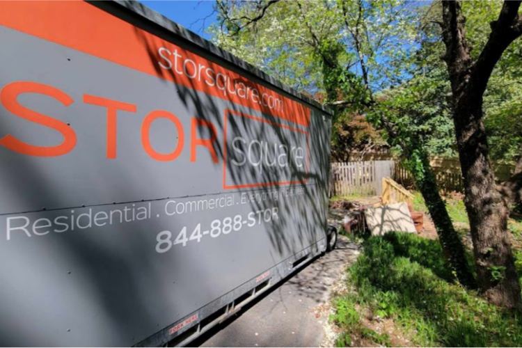 STORsquare portable storage container placed beside a wooded residential property in Granite Quarry, NC.
