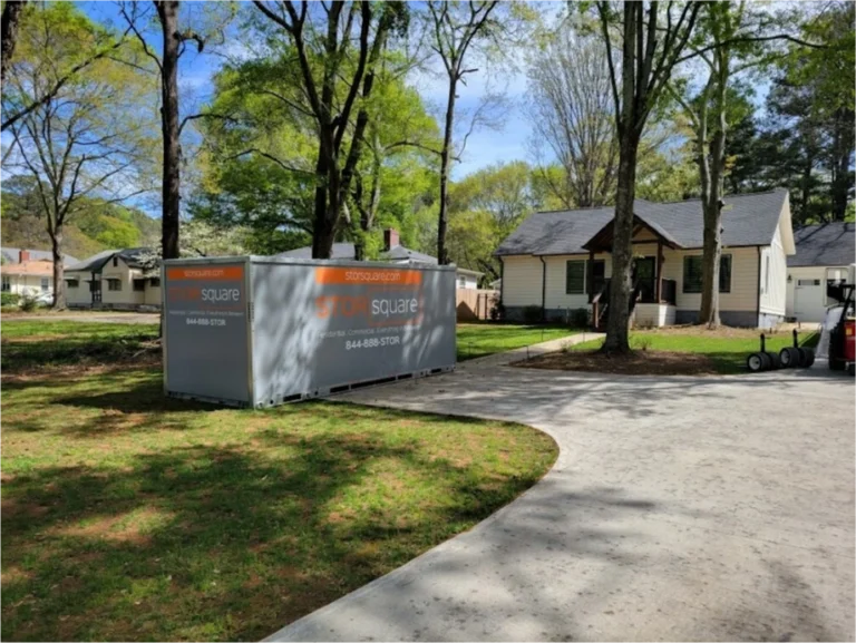 Two STORsquare portable storage containers placed in a wooded residential yard for customers in Bessemer City, NC.