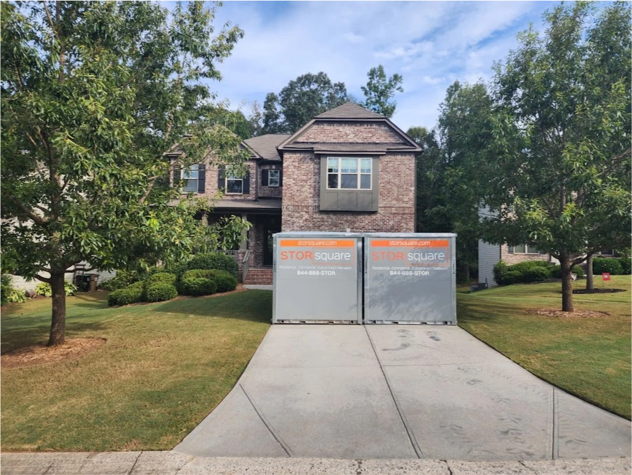 Two STORsquare portable storage containers placed side by side on a residential driveway in Karns, TN.
