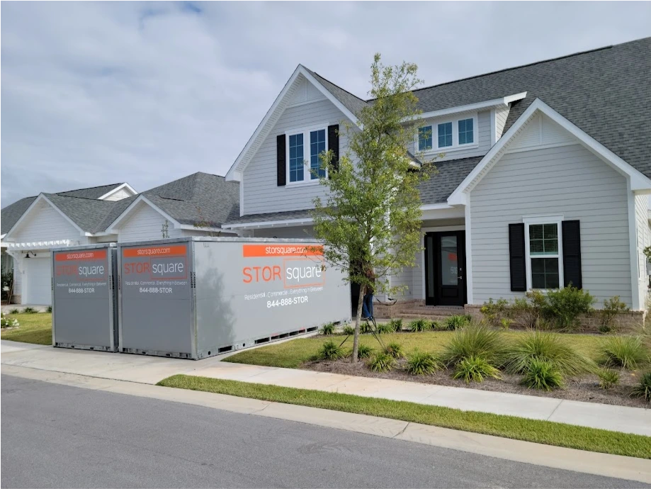 Two STORsquare portable storage containers placed in a residential driveway for customers in Mount Holly, NC.