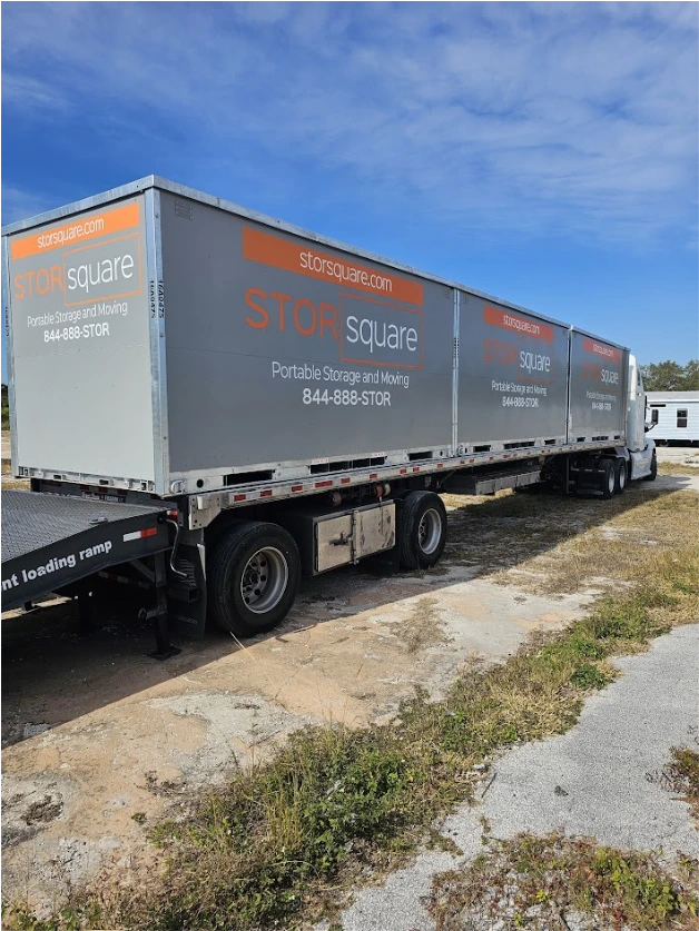 Multiple STORsquare portable storage containers secured on a transport truck for customers in Sequoyah Hills, TN.