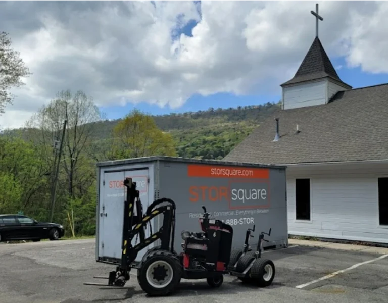 STORsquare portable storage unit positioned in a parking area beside a church for customers in Rutledge, GA.
