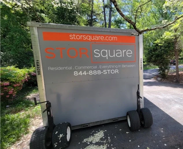 STORsquare portable storage unit positioned in a narrow residential driveway in Alturas, FL.
