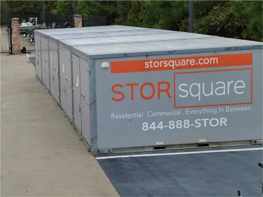 Multiple STORsquare portable storage units lined up at a secure storage yard serving Celebration, FL.