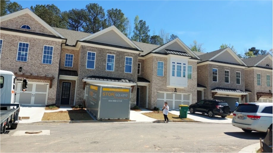STORsquare portable storage unit placed in front of a townhome driveway in Celebration, FL.