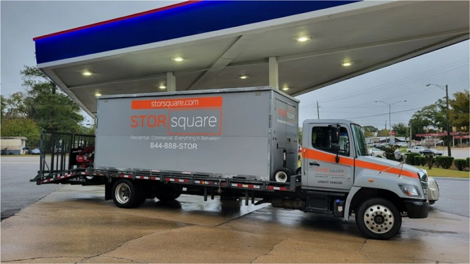 STORsquare transport truck carrying a portable storage container for customers in Bowling Green, NC.