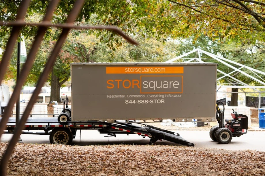 STORsquare portable storage container being unloaded from a trailer with the MULE system at an outdoor site in Kennesaw, GA.