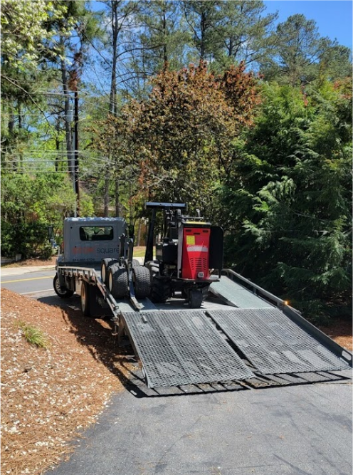STORsquare MULE delivery system positioned on a transport trailer along a wooded driveway in Madison, GA.