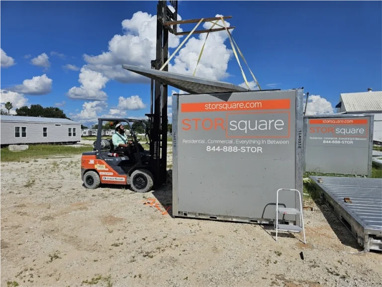 STORsquare portable storage container being handled with a forklift at a storage yard for customers in Clemmons, NC.