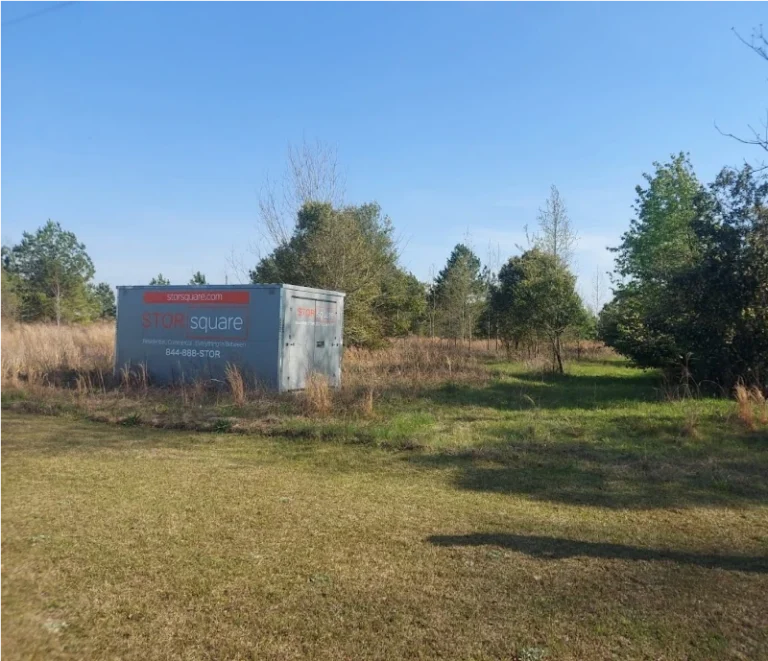 STORsquare portable storage container placed on a large grassy residential property for customers in Edgewood, FL.
