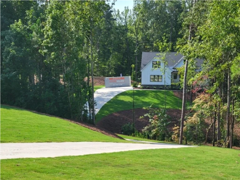 STORsquare portable storage container on the sloped driveway of a wooded residential property in Jasper, GA.