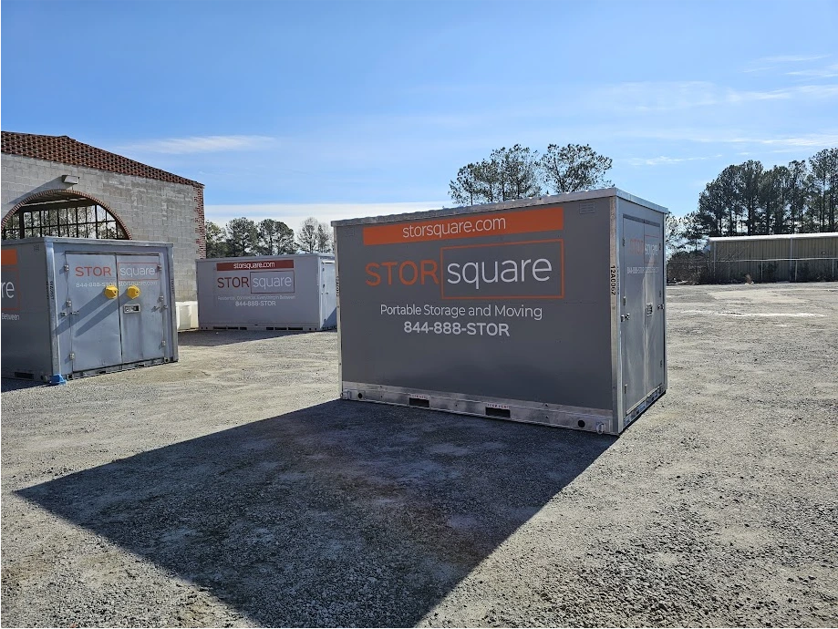 Multiple STORsquare portable storage containers positioned on a gravel lot for customers in Clemmons, NC.
