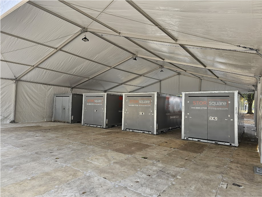 Multiple STORsquare portable storage containers arranged beneath a large covered structure in Kings Mountain, NC.